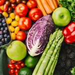 Different tasty vegetables on rough background