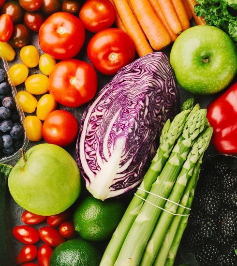 Different tasty vegetables on rough background